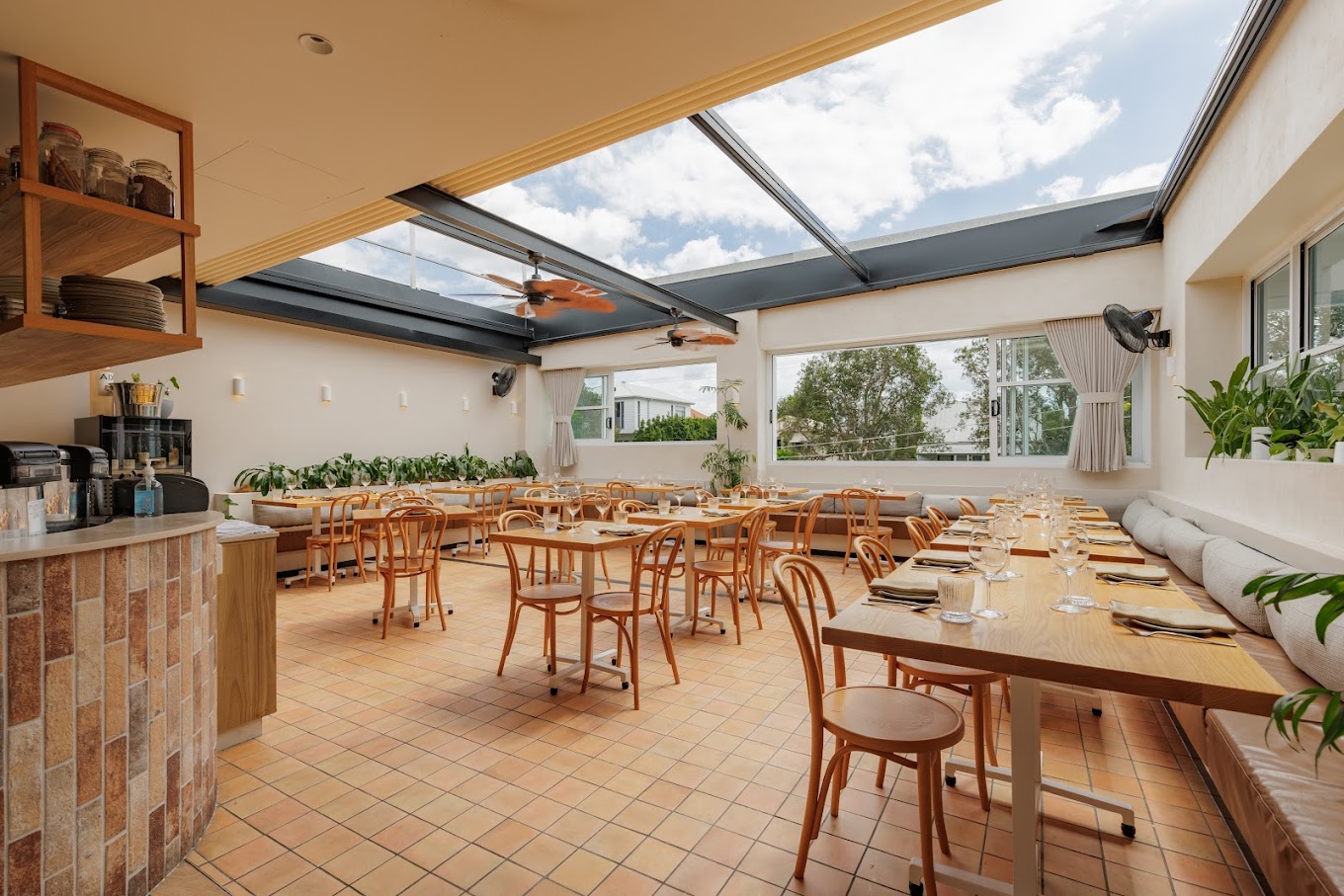 A bright restaurant dining room ready for guests